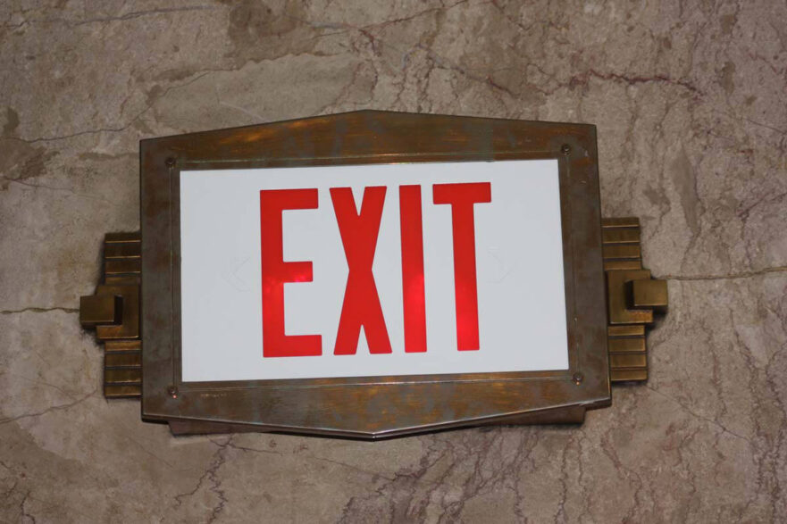 11 Exit sign, located in the main lobby, is done in bronze and displays Art Deco details.