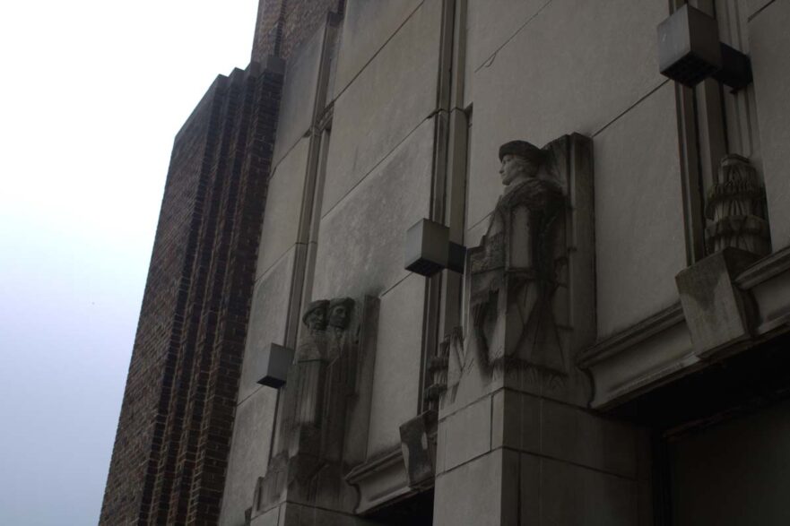 127 Figures above the north entrance on 119th Street in the 1938 addition, circa 2021