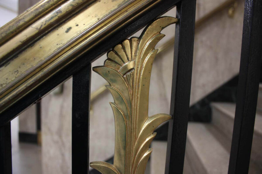 15 Close up of first floor railing detail, note the details include a scallop at the top and ridges that run the length of the piece.