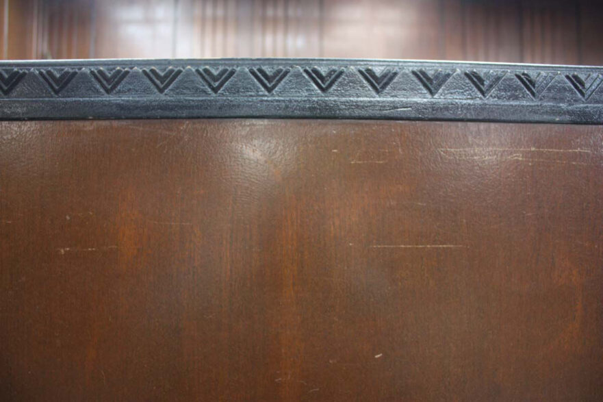 24 Chevron pattern adorning the bar and judges bench in the courtroom.