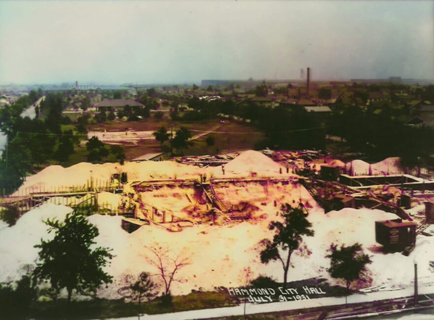 2C July 31, 1931, the front wall foundations are in place and the ground is being back filled to create the berm accommodating the steps. (Colorized 2022)