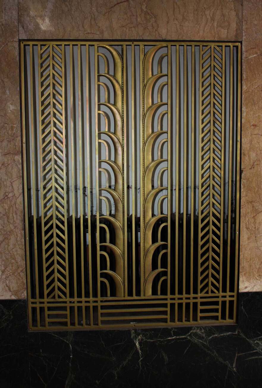 3 Heating grate cover in west vestibule of first floor lobby entrance, note that it pulls the main shape from the transom work.