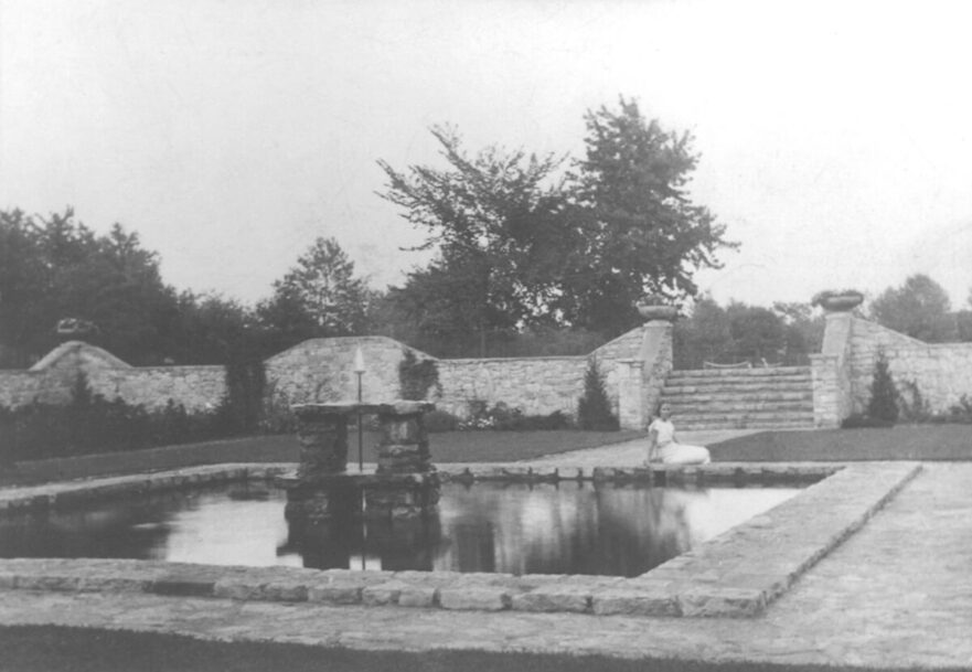 3 Girl reclining by pond in City Hall Park, circa 1941.