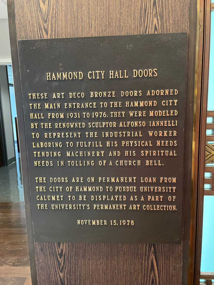 45 Plaque at Purdue University Northwest Hospitality and Tourisms Management building commemorating the installation of the original Iannelli bronze doors.