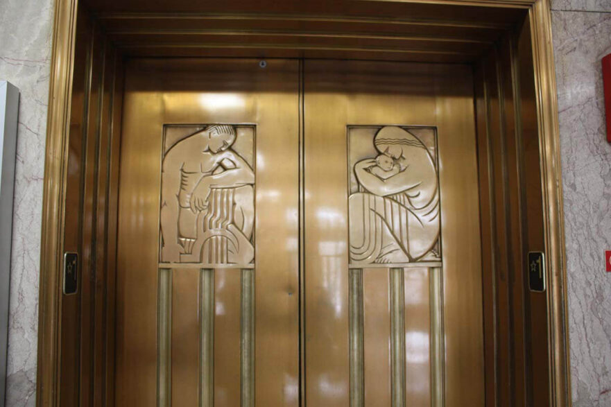 8 Elevator doors on main floor lobby. They are bronze and were designed by Alfonos Iannelli, an Italian-American sculptor and industrial designer. Iannelli gained a significant reputation when he was invited to work with Frank Lloyd Wright, on the Hyde Park “Midway Gardens” project in 1914, creating several of the “sprite sculptures.”